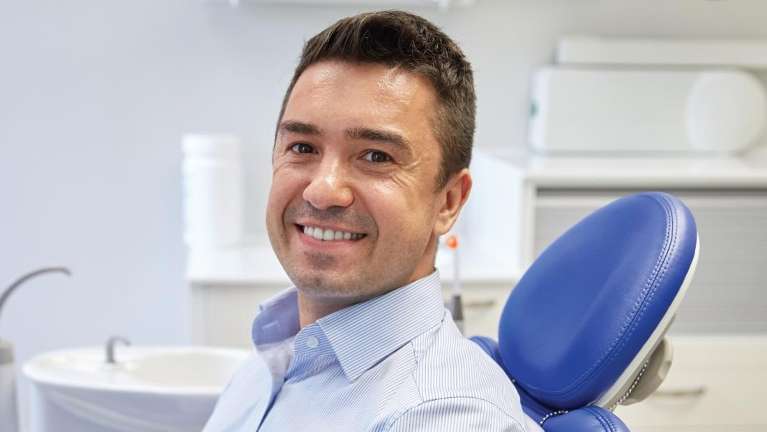 Man sitting in a dental chair
