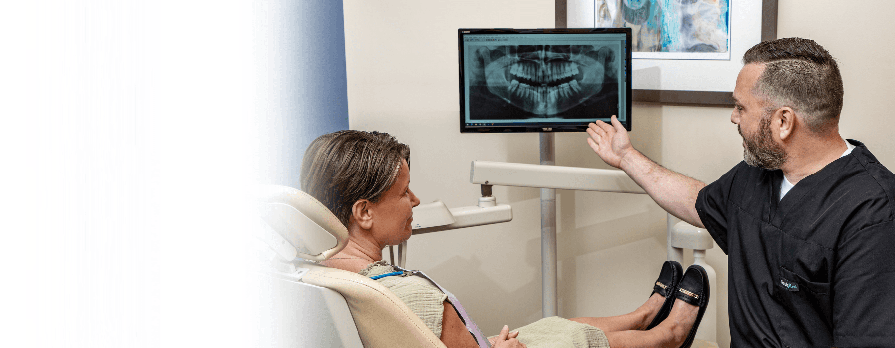 dentist showing patient root canal